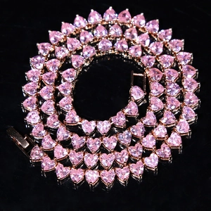 Detail of pink heart-shaped zircon tennis chain in rose gold plated finish for women