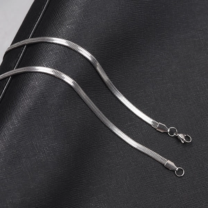 Detail of 4mm flat snake bone chain showing stainless steel links and lobster clasp