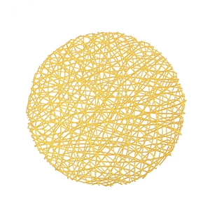 Golden round PVC placemat with elegant irregular mesh texture on a white background