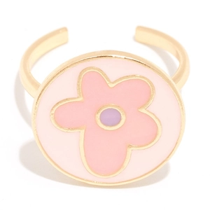 Detailed view of adjustable gold flower ring with pink enamel daisy and purple center