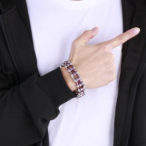 Detail of silver stainless steel industrial chain bracelet with purple inner link on wrist