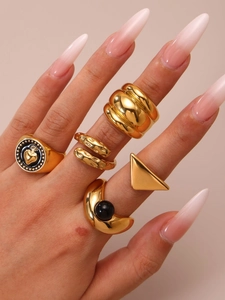 Detailed close-up of 18k gold plated chunky geometric stackable ring set on hand