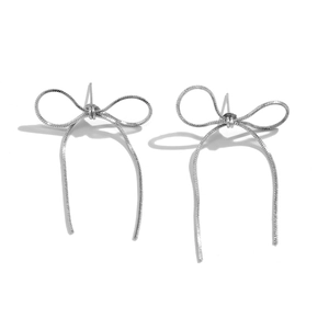 Minimalist silver bow stud earrings with a flexible metallic snake chain texture