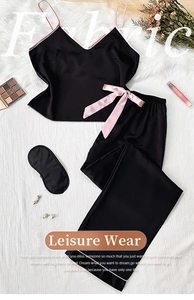 Ensemble de pyjama en satin noir avec bordure rose, détail nœud et masque de sommeil assorti