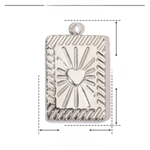 Detailed view of rectangular stainless steel pendant with heart engraving and dimensions
