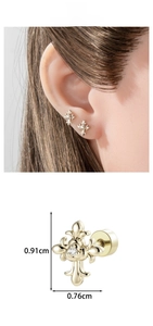 Macro detail of gothic cross earring showing 0.91cm size and clear zircon stone