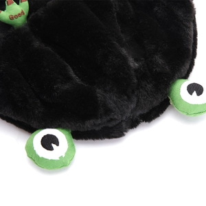 Detail of plush black frog hat with soft fur texture and green 'Good' embroidery