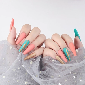 Matte long coffin press-on nails in coral pink and teal with gold glitter accents