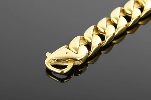 Close-up of 15mm gold Cuban link chain with high-polish finish and secure lobster clasp