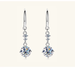 Macro detail of S925 sterling silver drop earrings with round moissanite stones