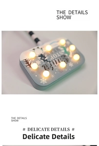 Detail of Christmas Santa Stop Here LED light board with warm snowflakes pattern