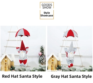Red and grey gnome Christmas ornaments with parachutes hanging in a cozy snow scene