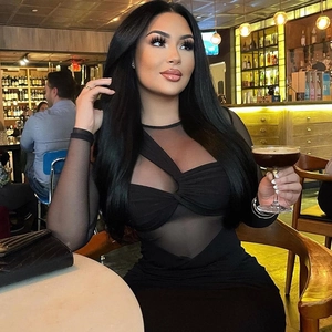 Elegant black bodycon dress featuring mesh patchwork and a stylish twisted bust design
