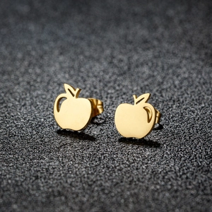 Minimalist gold apple shaped stainless steel stud earrings with hollow design on black surface