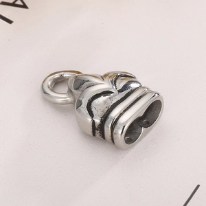 Detailed macro view of silver stainless steel double-hole leather cord bracelet clasp