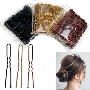 U-shaped hair pins set in gold, brown, and black colors for bridal styling and updo