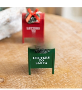 Close-up of green and red metal Christmas mailboxes with Letters to Santa text