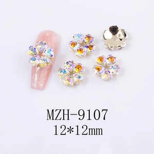 Macro shot of 12mm 3D nail art flower charms with AB rhinestones and golden base
