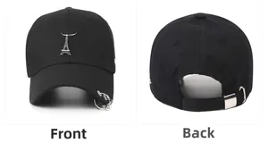 Detailed front and back view of a black cotton baseball cap with rings and tower pendant