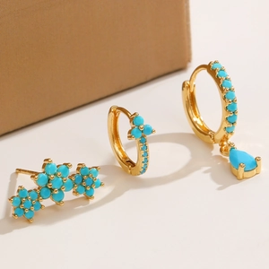 Bohemian gold plated earrings set with turquoise blue beads and floral stud accents