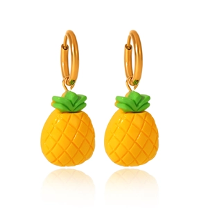 Detail of creative pineapple earrings with golden hoops and textured fruit pendants