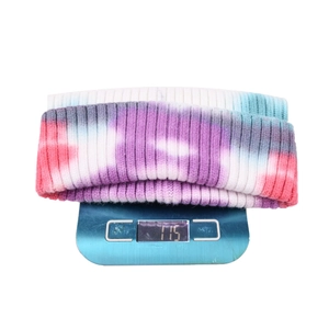Tie-dye ribbed knit beanie in pink and blue weighing 115g on a digital scale