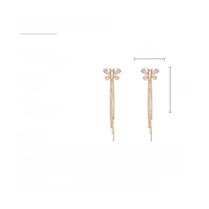 Macro detail of butterfly tassel earrings with copper, zircon stones and size specs