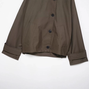 Fashionable waterproof trench coat for women in olive green with functional pockets