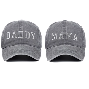 Close-up of DADDY and MAMA white embroidery on vintage washed grey cotton baseball caps