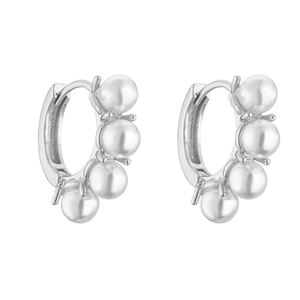 Close-up of silver hoop earrings with four inlaid white pearls and polished finish