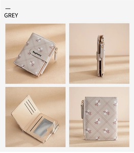 Detail view of grey PU leather wallet featuring floral pattern and internal card slots