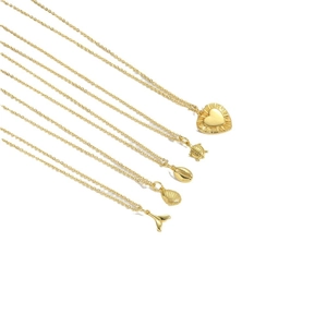 Gold pendant necklaces featuring heart, turtle, shell, conch, and fishtail designs on white background