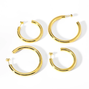 Polished 18k gold plated stainless steel C-shaped hoop earrings set on white background