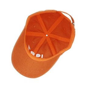 Internal view of orange cotton baseball cap showing six-panel stitch and metal buckle