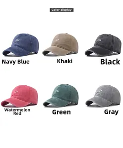 Color display of washed cotton baseball caps with embroidered smiley face in six colors
