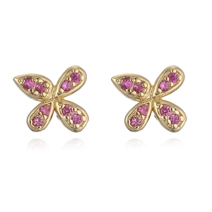 Elegant gold bow earrings with pink cubic zirconia stones and natural reflection