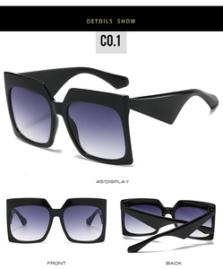 Oversized square sunglasses with purple gradient lenses and wide geometric temples