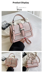 Pink crossbody square bag detail showing floral embossed texture and metal clasp