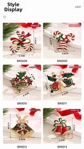 Detail shot of Christmas enamel brooches with candy canes and bells featuring white rhinestones