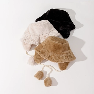 Winter faux rabbit fur bucket hats with earflaps and pom-pom ties in black, beige, and camel