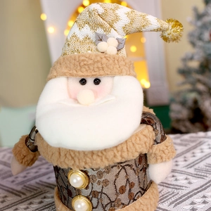 Dettaglio del barattolo di caramelle Babbo Natale in peluche con cappello dorato