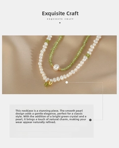 Close-up of double-layer necklace with white freshwater pearls and green peridot gemstone beads