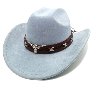 Detailed view of western cowboy hat with faux suede texture and bull head ornament