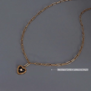 Gold-plated titanium steel chain with a black heart pendant featuring a sparkling crystal