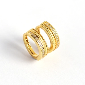 French style gold huggie earrings with twisted texture and cubic zirconia pave