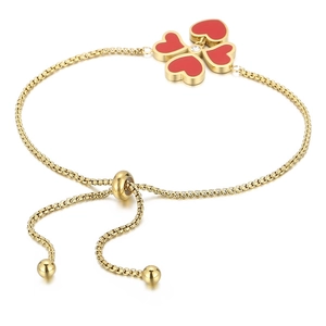 Bracciale regolabile in titanio dorato con ciondolo a quadrifoglio rosso e cristallo centrale
