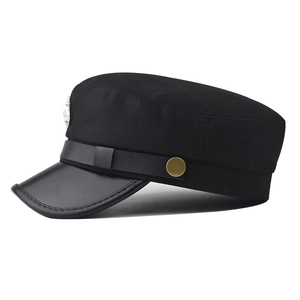 Detail of sailor hat featuring silver anchor badge and premium leather visor trim