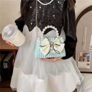 Girl's mint green tweed handbag with pearl handle and beige lace bow accessory