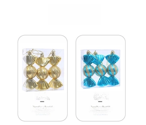 Detail of candy-shaped Christmas tree ornaments in gold and lake blue with glitter texture