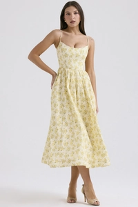 Detail of floral spaghetti strap midi dress with backless design and cinched waistline